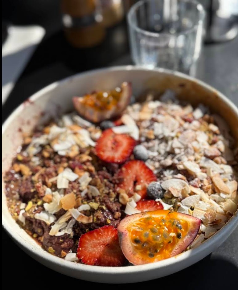 Breakfast porridge bowl with fresh fruit, made daily — Harry's Cafe, 73 Dohertys Rd Laverton North